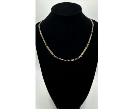 A 9ct yellow gold fancy linked box curb necklace, 22 inches long, hallmarked on first link, trigger hallmarked 9ct, approx we