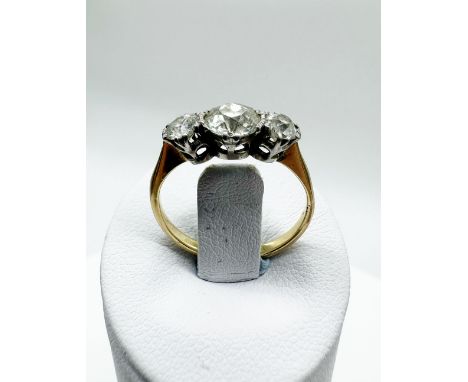 An 18ct yellow gold 3 stone diamond ring,
centre stone approx 0.70ct,
side stones approx 0.20ct each,
approx weight 2.3 grams