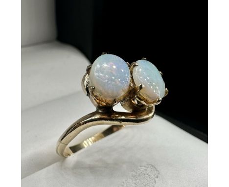 A 9ct yellow gold opal 2 stone twist style ring,
size M,
approx weight 2.7grams
in beautiful condition