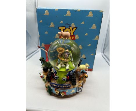 A large Toy Story 1990s vintage snow globe, musical, in original box