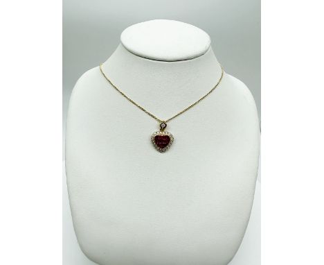 An 18ct yellow gold Ruby + Diamond heart shaped pendant on an 18ct yellow gold 18 inch chain, princess cut rubies, brilliant 