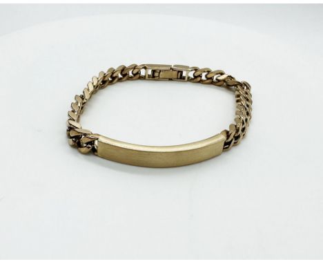 A 9ct yellow gold solid curb link ID bracelet, links 6mm wide x 2mm deep, ID is 4cm long, approx weight 33 grams, the bracele