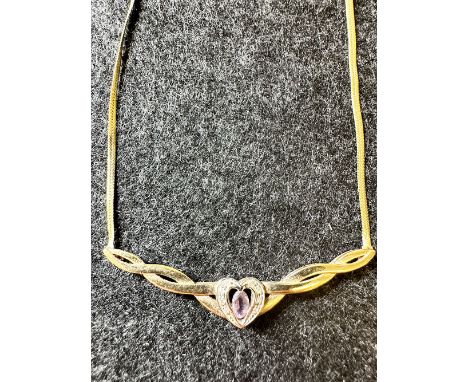 A 9ct yellow gold dress pendant necklace with amethyst + diamond herring bone style chain, approx weight 4.2 grams, 18 inches