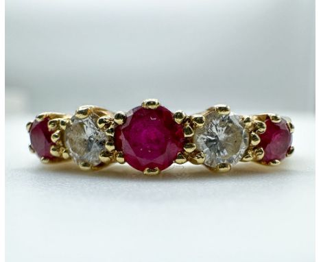 An 18ct yellow gold ruby + diamond eternity ring,
Size M,
in lovely condition
Ruby is 3mm in size
colour of diamonds H-I
clar