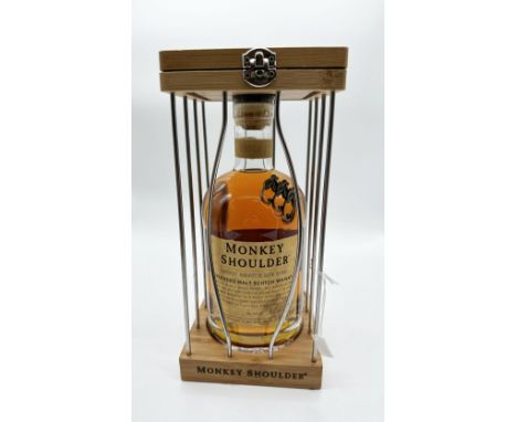 A bottle of Monkey Shoulder whisky in a cage,&nbsp;
a blended malt scotch whisky
40% abv
70cl bottle
pre-owned
in great condi