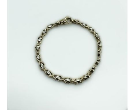 A 9ct yellow gold bracelet, 7 + 1/2 inches in length, approx weight 11.7 grams