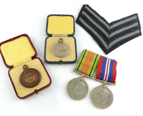 WW2 Defence and Victory medals, a silver life-saving medal and similar bronze medal (cased) awarded to P.J Pickess, and an RA