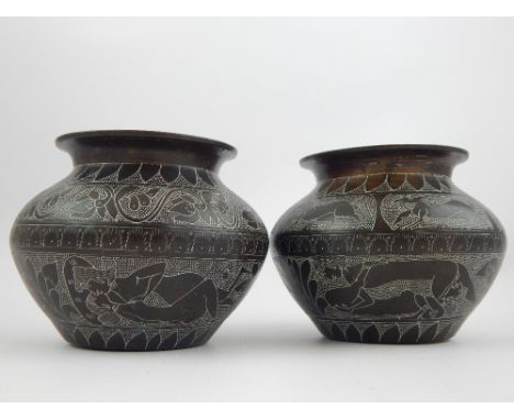 After the antique, a pair of Middle Eastern, possibly Syrian, engraved bronze vases decorated with erotic scenes, 9cm H.