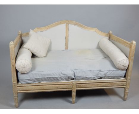 Limed oak continental sofa, camel back, leaf finials, box sides, tapering box legs, later upholstery, approx. 140cm w.