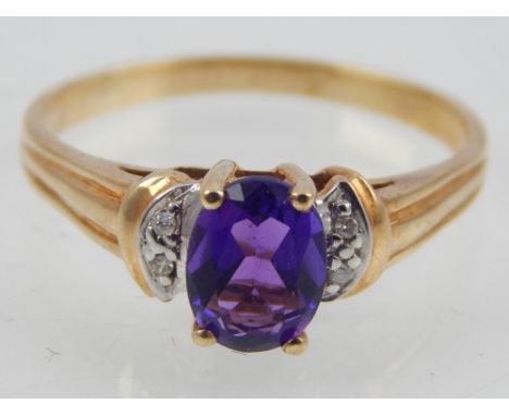 10ct yellow gold amethyst and diamond ring.