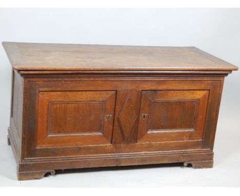 Oak coffer, lift up lid revealing salting trough, set over two doors, bracket feet, 19th C, 143.5cm w.