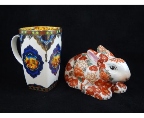 Chinese Imari pattern ceramic rabbit, 19cm, together with a mug. (2)