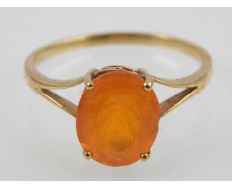 9ct yellow gold garnet single stone dress ring.