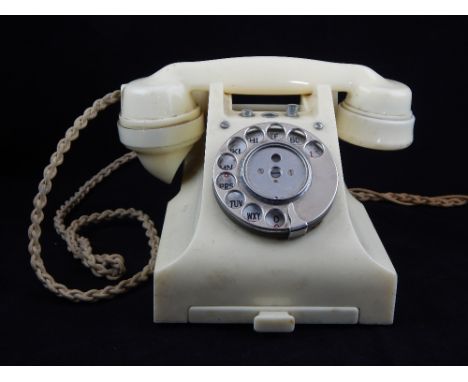 GPO ivory Bakelite 328 model telephone, incorporating two push button switches at the cradle.