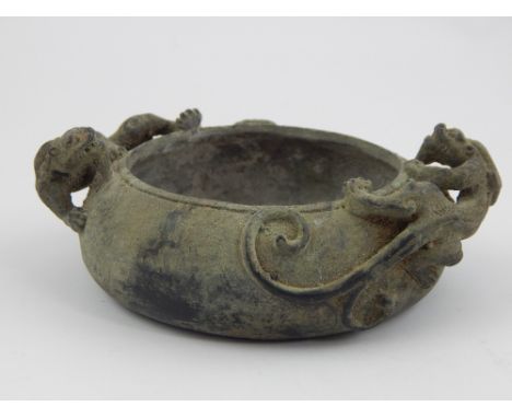 Chinese bronze censer with two dragons, impress stamp to base, approx 10cm dia.