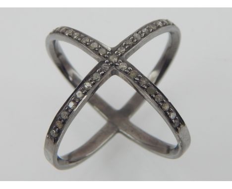 Black rhodium and diamond cross-over ring.