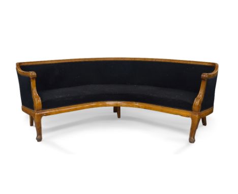 A Biedermeier style birch curved sofa, early 20th century, with black velour upholstery, raised on cabriole legs, 88cm high, 