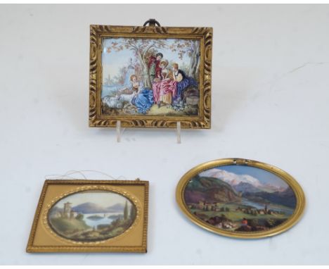 A Swiss enamel plaque, 19th century, depicting a church by a lake, mountains beyond, in an associated gilt-brass frame, 6cm w