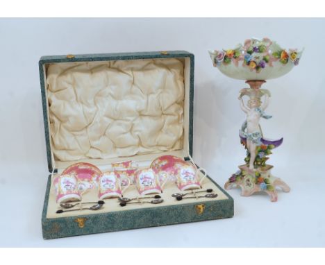 A set of six Minton Pink Cockatrice coffee cans and saucers, pattern no. 9646, with six silver coffee bean spoons, Birmingham