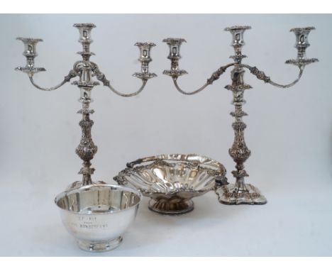 A pair of silver plated three light candelabra, on knopped and foliate decorated stems and shaped bases, 48.5cm high; togethe