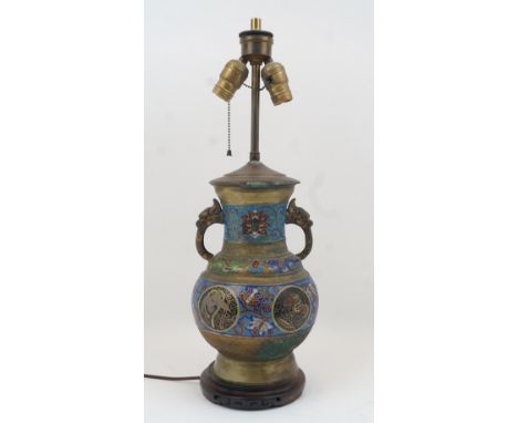A Chinese cloisonne twin handled lamp base, 20th century, the exterior with panels of foliate motifs and roundels featuring d