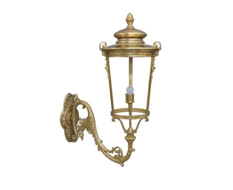 A large Victorian style gilt metal wall lantern, with pineapple finial and acanthus leaf scrolling wall mount, 123cm high, 47