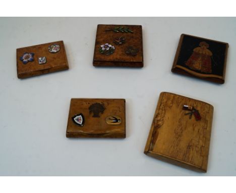 Five Russian corellian birch cigarette boxes, late 19th / early 20th century, to include one dated 1915 with enamel badge of 