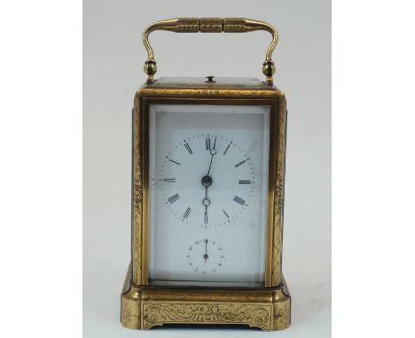 A French gilt-brass repeating alarm carriage clock, early 20th century, the case chased with foliate decoration and having sw