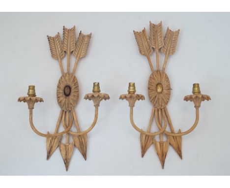 A pair of two light wall appliques, late 20th century, painted resin, in the form of three arrows about a central floral pate