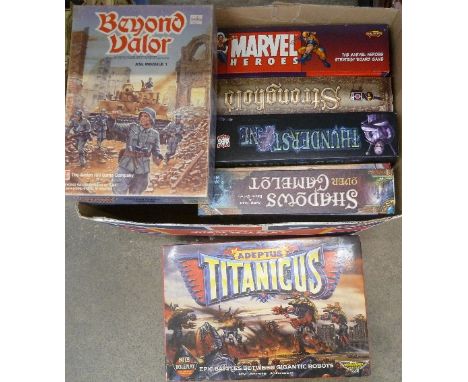 A box of role playing war games, including Adeptus Titanicus, Marvel Heroes, Shadows over Camelot, Thunderstone, etc.