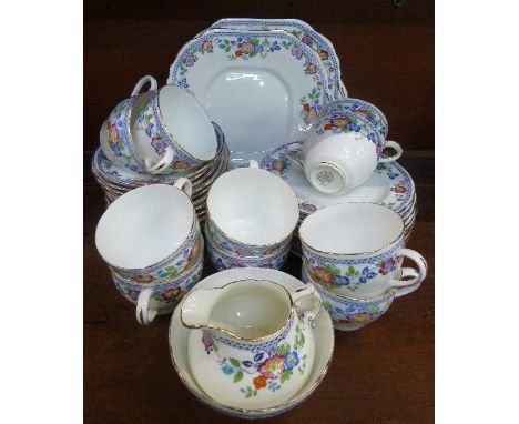 A part Hammersley tea service, including ten cups, saucers and side plates and two extra saucers, a/f