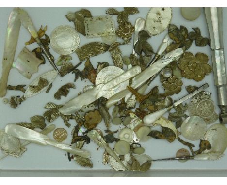 Mother of pearl items to include a pair of cufflinks, gaming counters, buttons, etc.