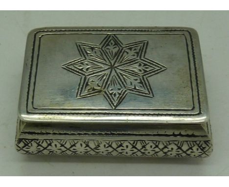 A white metal snuff box