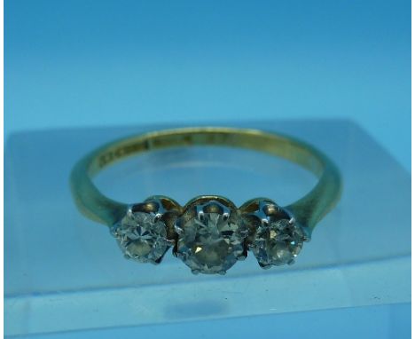 An 18ct gold and three stone diamond ring, weight 2.1g, size M