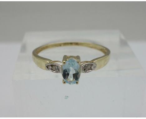 A 9ct gold, diamond and blue stone ring, weight 0.9g, size O