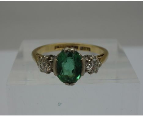 An 18ct gold, diamond and green stone ring, weight 3.6g, size N