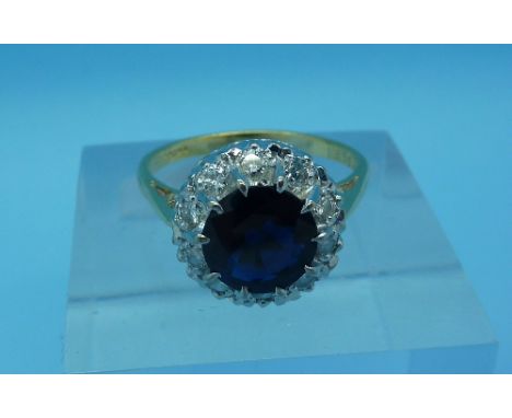 An 18ct gold, diamond and sapphire cluster ring, weight 4.4g, size O