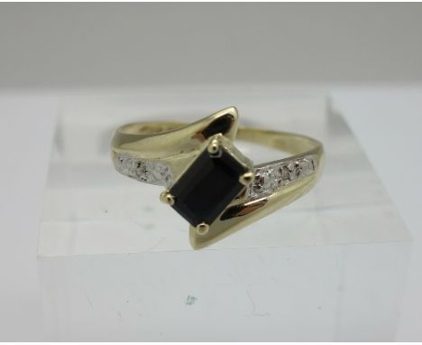 A 9ct gold, sapphire and diamond ring, weight 1.3g, size U