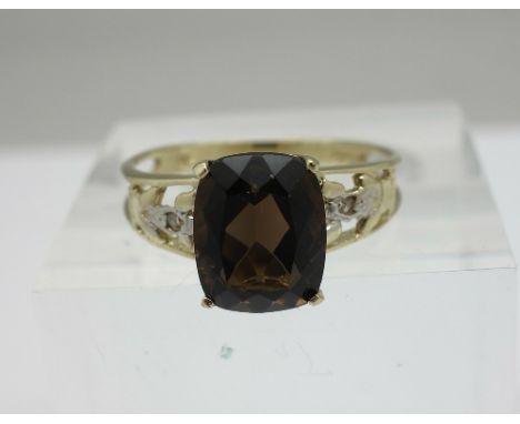 A 9ct gold, smoky quartz and diamond ring, weight 1.8g, size N