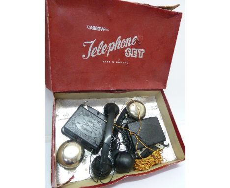 A boxed Bakelite telephone set by Arrow