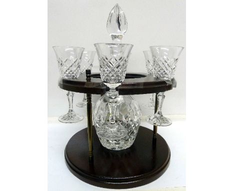 A seven piece decanter drinking set with stand
