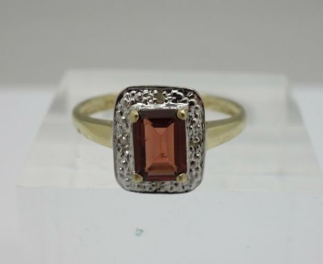 A 9ct gold, diamond and garnet ring, weight 1.4g, size O