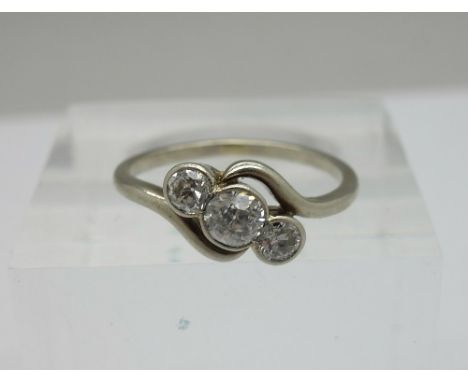 A white metal set, three stone diamond trilogy ring, c.1930, approximately 0.45ct diamond weight, weight 1.8g, size K