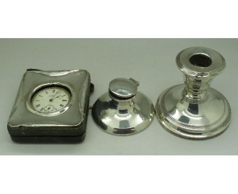 A silver inkwell, candlestick and pocket watch travel case