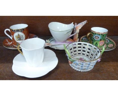 A Dresden pierced basket, four cups and saucers comprising Franz, Wedgwood, Shelley and Royal Worcester