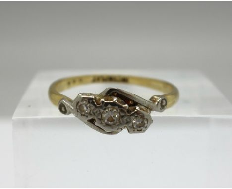 An 18ct gold three stone diamond ring, weight 2.2g, size N