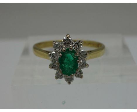 An 18ct gold, diamond and emerald cluster ring, 0.30ct diamond weight, weight 2.8g, size N