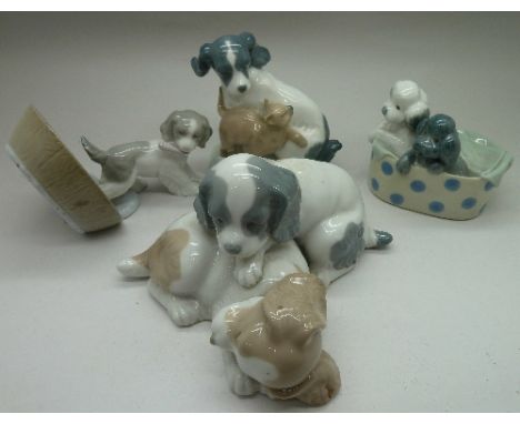 Four Nao figures, Puppy Playtime and three other dog figures, boxed, a/f