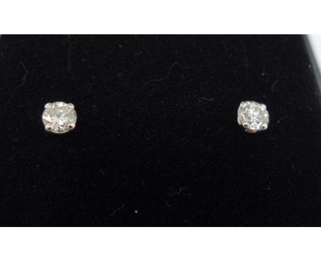 A pair of 18ct white gold and diamond stud earrings, total diamond weight 0.62ct