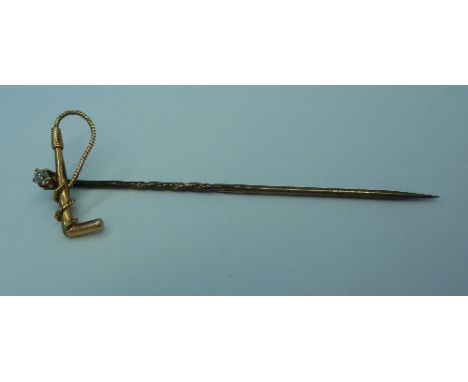 A gold and diamond riding crop stick pin, weight 1.6g, a/f